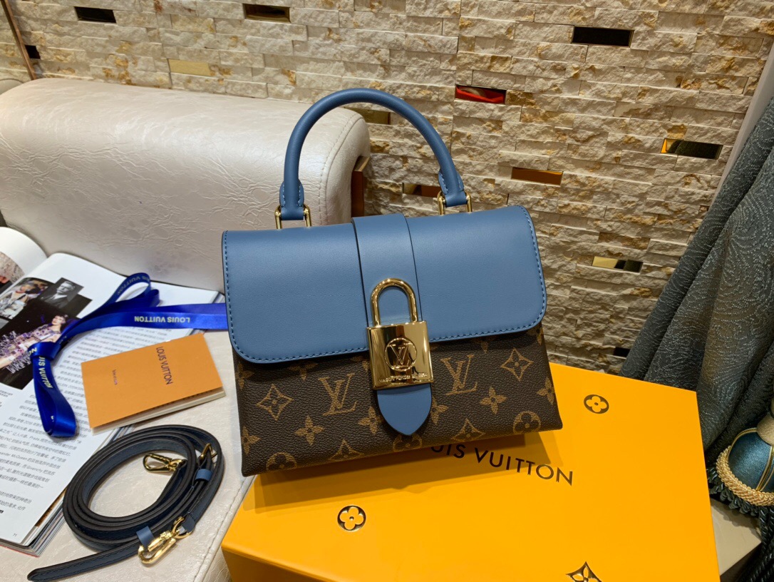 LOUIS VUITTON Locky BB Shoulder Bag. Original Quality Bag including gift box, care book, dust bag, authenticity card. Small and structured, the Locky BB bag in Epi leather combines refinement with bold statement style, thanks to an oversized gold-metal LV padlock closure. A fashionable day-to-evening piece, it can be worn in any number of ways to suit the mood or occasion: by hand, on the elbow, over the shoulder or cross body on its detachable strap. | CRIS&COCO Authentic Quality Designer Bag and Luxury Accessories