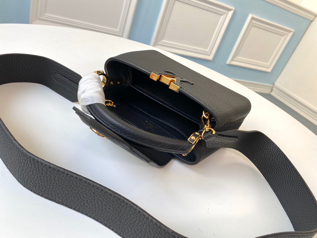 LOUIS VUITTON Capucines Mini. Original Quality Bag including gift box, literature, dust bag, authenticity card. Fashioned from vibrantly colored Taurillon leather, the Capucines Mini handbag pops. The fresh new colorway is perfectly complemented by the discreet metal handle rings. Like all Capucines, the Mini can be carried with the flap out for simple sophistication or tucked inside to feature the LV Initials. | CRIS&COCO Authentic Quality Designer Bag and Luxury Accessories