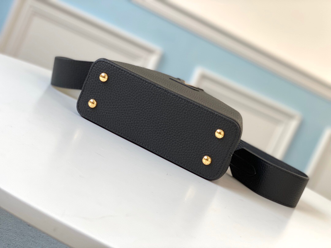 LOUIS VUITTON Capucines Mini. Original Quality Bag including gift box, literature, dust bag, authenticity card. Fashioned from vibrantly colored Taurillon leather, the Capucines Mini handbag pops. The fresh new colorway is perfectly complemented by the discreet metal handle rings. Like all Capucines, the Mini can be carried with the flap out for simple sophistication or tucked inside to feature the LV Initials. | CRIS&COCO Authentic Quality Designer Bag and Luxury Accessories