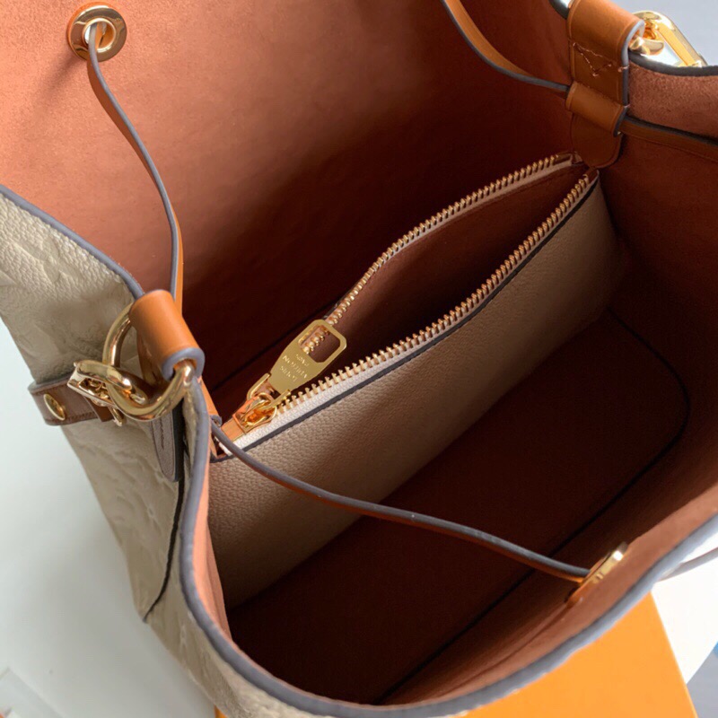 LOUIS VUITTON NéoNoé Monogram Empreinte. Original Quality Bag including gift box, literature, dust bag, authenticity card. A new iteration of the brand’s most popular bag from yesteryears, the NéoNoé in its novel avatar is introduced in stunning Monogram Empreinte. Crafted from supple embossed leather, the bag is available in Noir, Rouge, Crème, and Marine, in a standard ‘MM’ size. The trendy piece features a body-friendly design that is both light-weight as well as comfortable to carry. It comes with a detachable and adjustable strap and a removable top handle and can be doubled as an over-the-shoulder/ cross-body version or a tote variant.| CRIS&COCO Authentic Quality Designer Bags and Luxury Accessories