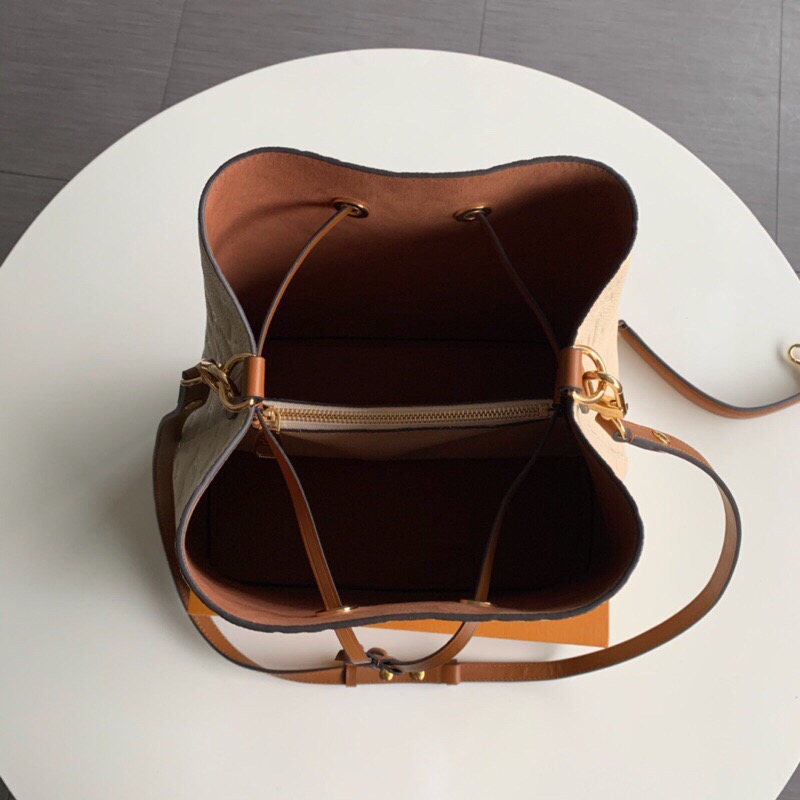 LOUIS VUITTON NéoNoé Monogram Empreinte. Original Quality Bag including gift box, literature, dust bag, authenticity card. A new iteration of the brand’s most popular bag from yesteryears, the NéoNoé in its novel avatar is introduced in stunning Monogram Empreinte. Crafted from supple embossed leather, the bag is available in Noir, Rouge, Crème, and Marine, in a standard ‘MM’ size. The trendy piece features a body-friendly design that is both light-weight as well as comfortable to carry. It comes with a detachable and adjustable strap and a removable top handle and can be doubled as an over-the-shoulder/ cross-body version or a tote variant.| CRIS&COCO Authentic Quality Designer Bags and Luxury Accessories