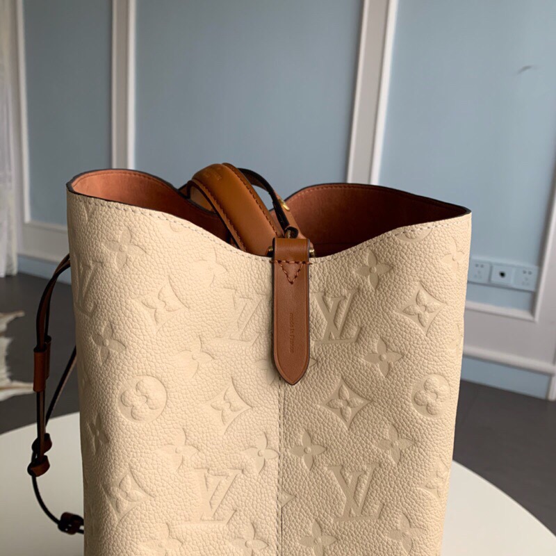 LOUIS VUITTON NéoNoé Monogram Empreinte. Original Quality Bag including gift box, literature, dust bag, authenticity card. A new iteration of the brand’s most popular bag from yesteryears, the NéoNoé in its novel avatar is introduced in stunning Monogram Empreinte. Crafted from supple embossed leather, the bag is available in Noir, Rouge, Crème, and Marine, in a standard ‘MM’ size. The trendy piece features a body-friendly design that is both light-weight as well as comfortable to carry. It comes with a detachable and adjustable strap and a removable top handle and can be doubled as an over-the-shoulder/ cross-body version or a tote variant.| CRIS&COCO Authentic Quality Designer Bags and Luxury Accessories