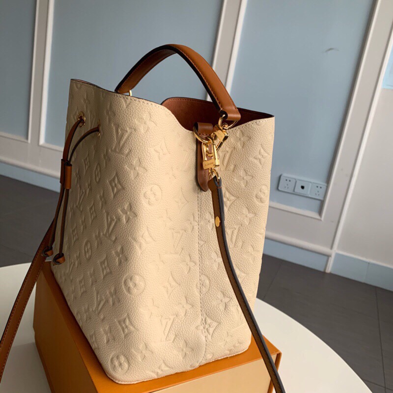 LOUIS VUITTON NéoNoé Monogram Empreinte. Original Quality Bag including gift box, literature, dust bag, authenticity card. A new iteration of the brand’s most popular bag from yesteryears, the NéoNoé in its novel avatar is introduced in stunning Monogram Empreinte. Crafted from supple embossed leather, the bag is available in Noir, Rouge, Crème, and Marine, in a standard ‘MM’ size. The trendy piece features a body-friendly design that is both light-weight as well as comfortable to carry. It comes with a detachable and adjustable strap and a removable top handle and can be doubled as an over-the-shoulder/ cross-body version or a tote variant.| CRIS&COCO Authentic Quality Designer Bags and Luxury Accessories