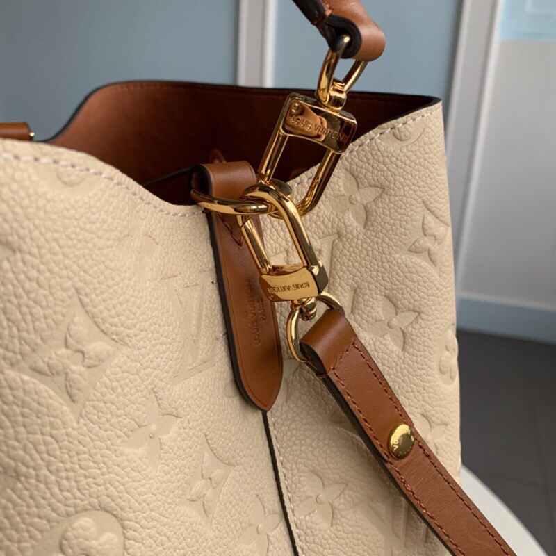 LOUIS VUITTON NéoNoé Monogram Empreinte. Original Quality Bag including gift box, literature, dust bag, authenticity card. A new iteration of the brand’s most popular bag from yesteryears, the NéoNoé in its novel avatar is introduced in stunning Monogram Empreinte. Crafted from supple embossed leather, the bag is available in Noir, Rouge, Crème, and Marine, in a standard ‘MM’ size. The trendy piece features a body-friendly design that is both light-weight as well as comfortable to carry. It comes with a detachable and adjustable strap and a removable top handle and can be doubled as an over-the-shoulder/ cross-body version or a tote variant.| CRIS&COCO Authentic Quality Designer Bags and Luxury Accessories