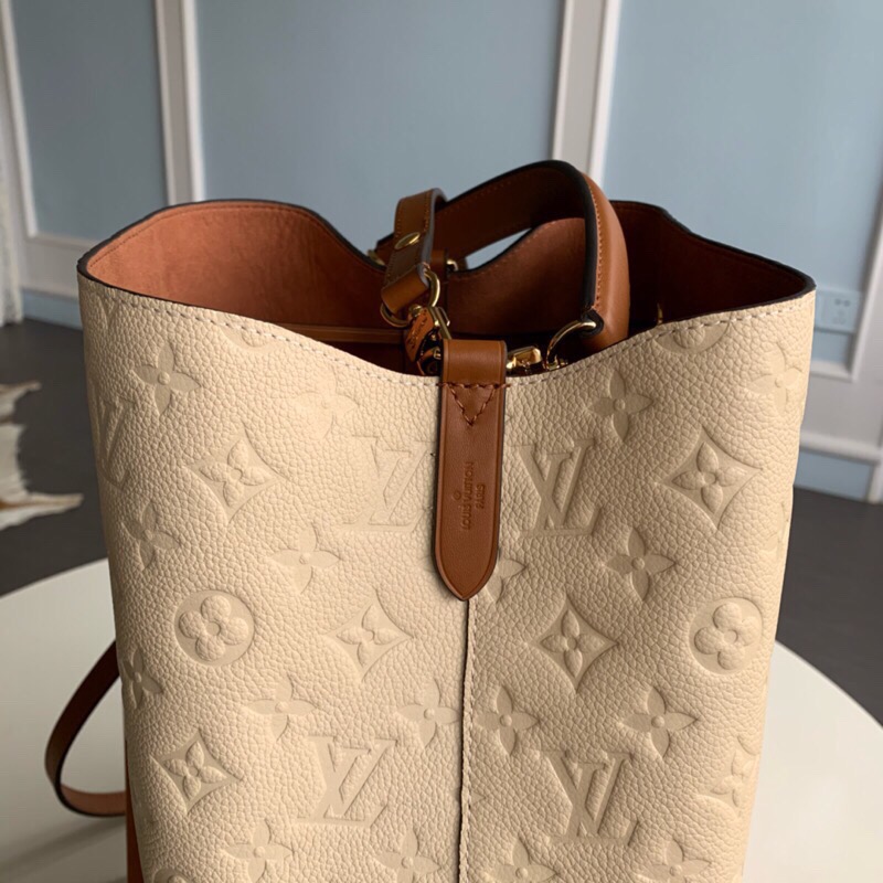 LOUIS VUITTON NéoNoé Monogram Empreinte. Original Quality Bag including gift box, literature, dust bag, authenticity card. A new iteration of the brand’s most popular bag from yesteryears, the NéoNoé in its novel avatar is introduced in stunning Monogram Empreinte. Crafted from supple embossed leather, the bag is available in Noir, Rouge, Crème, and Marine, in a standard ‘MM’ size. The trendy piece features a body-friendly design that is both light-weight as well as comfortable to carry. It comes with a detachable and adjustable strap and a removable top handle and can be doubled as an over-the-shoulder/ cross-body version or a tote variant.| CRIS&COCO Authentic Quality Designer Bags and Luxury Accessories