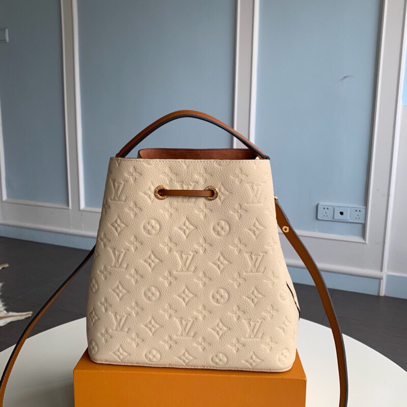 LOUIS VUITTON NéoNoé Monogram Empreinte. Original Quality Bag including gift box, literature, dust bag, authenticity card. A new iteration of the brand’s most popular bag from yesteryears, the NéoNoé in its novel avatar is introduced in stunning Monogram Empreinte. Crafted from supple embossed leather, the bag is available in Noir, Rouge, Crème, and Marine, in a standard ‘MM’ size. The trendy piece features a body-friendly design that is both light-weight as well as comfortable to carry. It comes with a detachable and adjustable strap and a removable top handle and can be doubled as an over-the-shoulder/ cross-body version or a tote variant.| CRIS&COCO Authentic Quality Designer Bags and Luxury Accessories