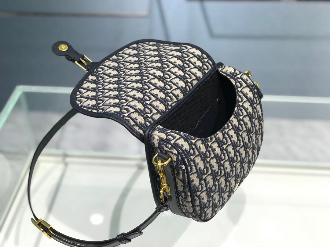 DIOR Small Bobby Bag. Original Quality Bag, including gift box, literature, dust bag, authenticity card. Maria Grazia Chiuri introduced a new silhouette to the French fashion house’s repertoire of It bags: the Dior Bobby which pays homage to the lovely pooch of the master himself. The Dior Bobby is a rounded flap that is similar to the D-fence bag with the classic CD logo. Got to admit, Bobby offers the best size for a bag that’s meant to be functional, easy to strut around in while looking like a million bucks. The Dior Bobby is a sassy shoulder bag that’s well suited for today’s call for practicality. Its feminine curve and the ‘30 Montaigne’ address on the back, renders a subtle echo of the eponymous symbolic bag. | crisandcoco designer bags and accessories