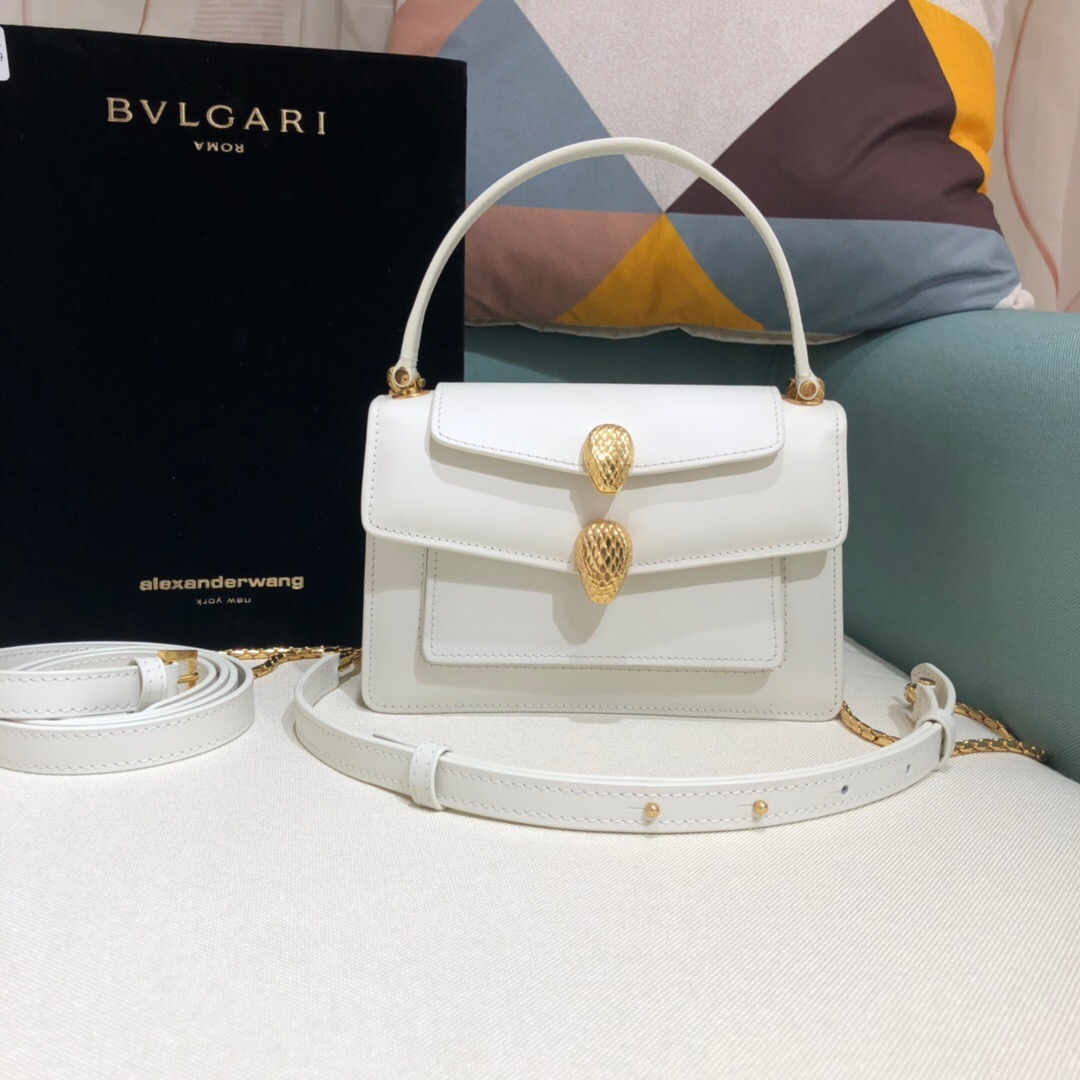 ALEXANDER WANG x BVULGARI Belt Bag - CRIS&COCO ALEXANDER WANG x BVLGARI Belt Bag. Original Quality Bag including gift box, care book, dust bag, authenticity card. The belt bag is a dream to style, as it features two detachable straps and a detachable handle and can be worn on the waist, as a crossbody bag, as a clutch or over the shoulder. BVLGARI and ALEXANDER WANG have reprised Serpenti Through The Eyes of ALEXANDER WANG for 2020, with the exciting addition of two brand new bags. While the two in-demand fashion houses may not reveal themselves to be the most obvious collaborators at a superficial glance, they have nonetheless merged to produce their latest capsule collection infusing allure with innovation. | Cris and Coco Authentic Quality designer bags and luxury accessories.