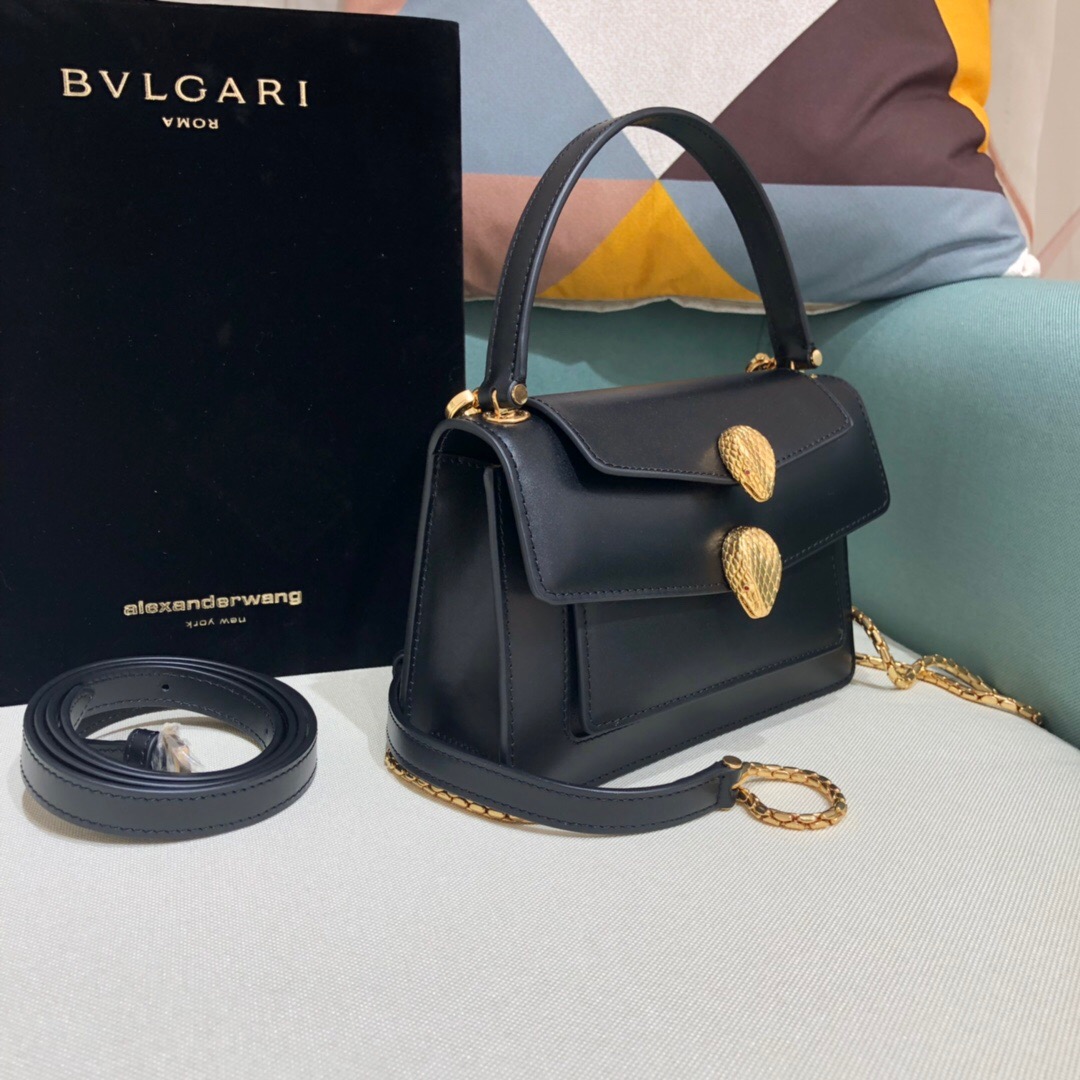 ALEXANDER WANG x BVULGARI Belt Bag - CRIS&COCO ALEXANDER WANG x BVLGARI Belt Bag. Original Quality Bag including gift box, care book, dust bag, authenticity card. The belt bag is a dream to style, as it features two detachable straps and a detachable handle and can be worn on the waist, as a crossbody bag, as a clutch or over the shoulder. BVLGARI and ALEXANDER WANG have reprised Serpenti Through The Eyes of ALEXANDER WANG for 2020, with the exciting addition of two brand new bags. While the two in-demand fashion houses may not reveal themselves to be the most obvious collaborators at a superficial glance, they have nonetheless merged to produce their latest capsule collection infusing allure with innovation. | Cris and Coco Authentic Quality designer bags and luxury accessories.