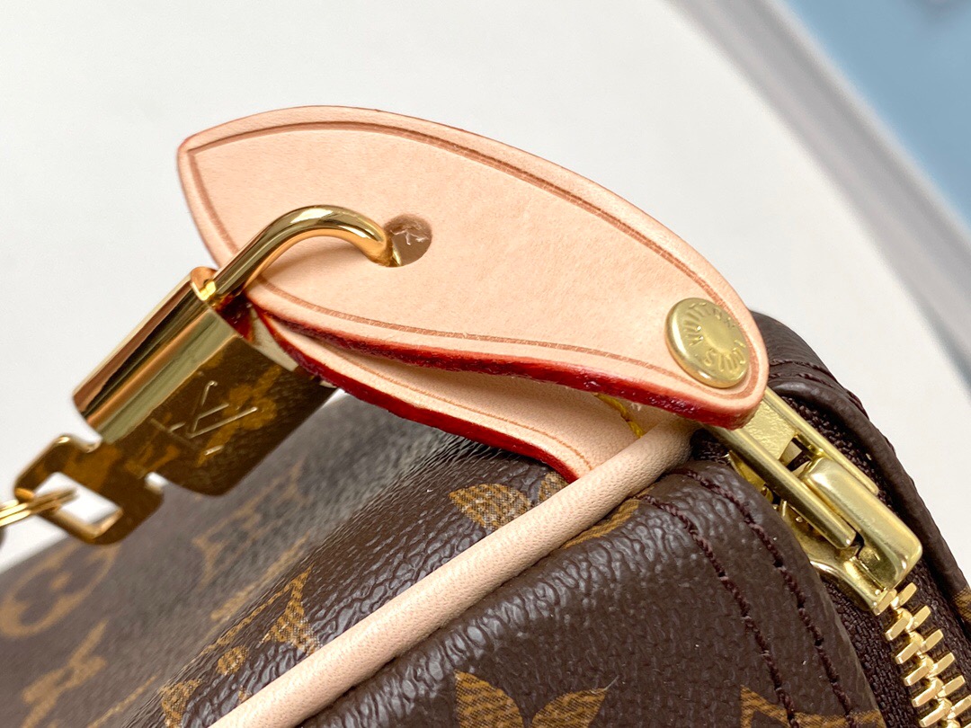 LOUIS VUITTON Speedy 30. Original Quality Bag including gift box, care book, dust bag, authenticity card. Made from iconic Monogram canvas, the LV Speedy 30 is an elegant, compact handbag, a stylish companion for city life. Launched in 1930 as the "Express" and inspired by that era's rapid transit, today’s updated Speedy remains a timeless House icon, with its unmistakable silhouette, rolled leather handles, and engraved, signature padlock. | CRIS&COCO Authentic Quality Bags and Luxury Accessories