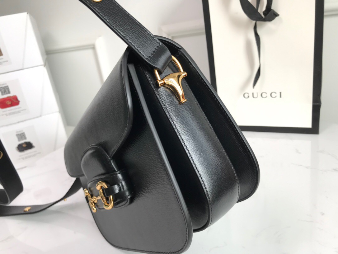 GUCCI 1955 Horsebit Shoulder Bag. High-end quality bag including gift box, literature, dust bag, authenticity card. Introduced for Cruise 2020, the Gucci Horsebit 1955 bag is recreated from an archival design. With the same lines and forms first introduced over six decades ago, the accessory unifies the original details with a modern spirit, highlighting the Horsebit. Part of Gucci’s genetic code, the double ring, and bar design has been established as one of the most distinctive elements among the House symbols borrowed from the equestrian world. Presented on a small flap shoulder bag, the hardware is paired with the House’s monogram fabric and completed with a special mechanism that adjusts the length of the shoulder strap so it can be carried on one shoulder or crossbody. Pieces with versatile ways to wear and style embrace each person who is part of the House’s individual spirit. | Cris and Coco High Quality Bags and Luxury Accessories
