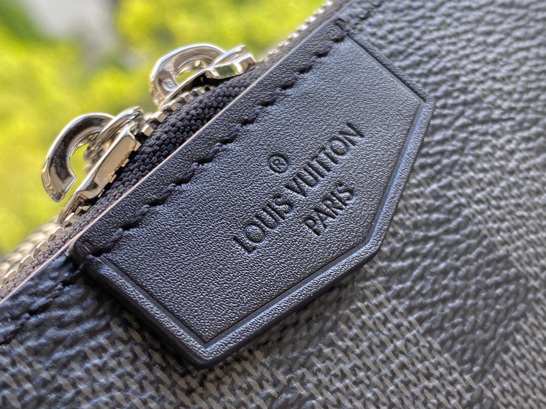 LOUIS VUITTON Alpha Wearable Damier Graphite Wallet. Original Quality Wallet including gift box, care book, dust bag, authenticity card. This Alpha Wearable Wallet is a versatile compact bag. Thanks to its adjustable and removable strap, thus it can be carried in different ways. This is made from Damier Graphite canvas and trimmed in black leather. The wide opening and side gussets give easy access to belongings inside. Perfect for carrying a phone (or two) and a wallet. | CRIS&COCO Authentic Quality Designer Bags and Luxury Accessories