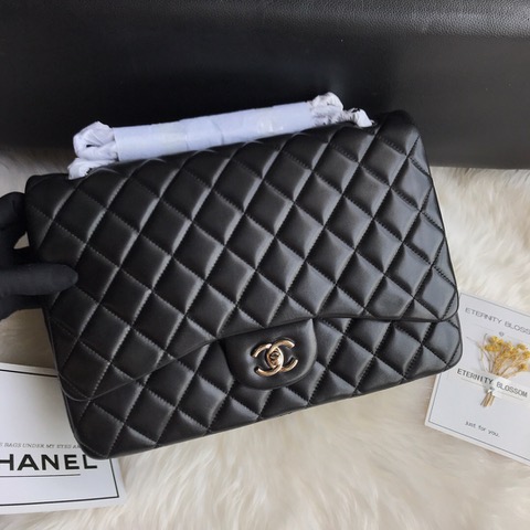 CHANEL Maxi Classic Handbag. Original Quality Bag including gift box, care book, dust bag, authenticity card. The Maxi Classic Double Flap bags are available in both grained calfskin and lambskin with silver/gold tone hardware. This classic handbag features a front flap with signature CC turn lock closure, half-moon back pocket. Also an adjustable interwoven silver/gold tone chain link and leather shoulder strap. | CRIS&COCO Authentic Quality Designer Bags and Luxury Accessories