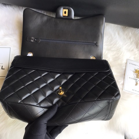 CHANEL Maxi Classic Handbag. Original Quality Bag including gift box, care book, dust bag, authenticity card. The Maxi Classic Double Flap bags are available in both grained calfskin and lambskin with silver/gold tone hardware. This classic handbag features a front flap with signature CC turn lock closure, half-moon back pocket. Also an adjustable interwoven silver/gold tone chain link and leather shoulder strap. | CRIS&COCO Authentic Quality Designer Bags and Luxury Accessories