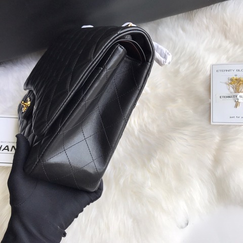 CHANEL Maxi Classic Handbag. Original Quality Bag including gift box, care book, dust bag, authenticity card. The Maxi Classic Double Flap bags are available in both grained calfskin and lambskin with silver/gold tone hardware. This classic handbag features a front flap with signature CC turn lock closure, half-moon back pocket. Also an adjustable interwoven silver/gold tone chain link and leather shoulder strap. | CRIS&COCO Authentic Quality Designer Bags and Luxury Accessories