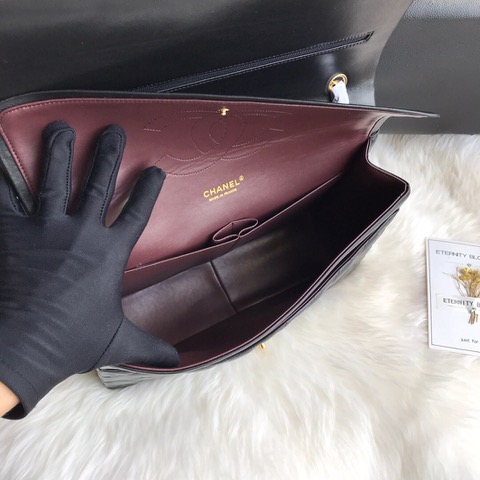 CHANEL Maxi Classic Handbag. Original Quality Bag including gift box, care book, dust bag, authenticity card. The Maxi Classic Double Flap bags are available in both grained calfskin and lambskin with silver/gold tone hardware. This classic handbag features a front flap with signature CC turn lock closure, half-moon back pocket. Also an adjustable interwoven silver/gold tone chain link and leather shoulder strap. | CRIS&COCO Authentic Quality Designer Bags and Luxury Accessories