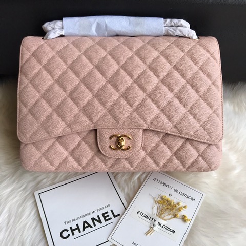 CHANEL Maxi Classic Handbag. Original Quality Bag including gift box, care book, dust bag, authenticity card. The Maxi Classic Double Flap bags are available in both grained calfskin and lambskin with silver/gold tone hardware. This classic handbag features a front flap with signature CC turn lock closure, half-moon back pocket. Also an adjustable interwoven silver/gold tone chain link and leather shoulder strap. | CRIS&COCO Authentic Quality Designer Bags and Luxury Accessories