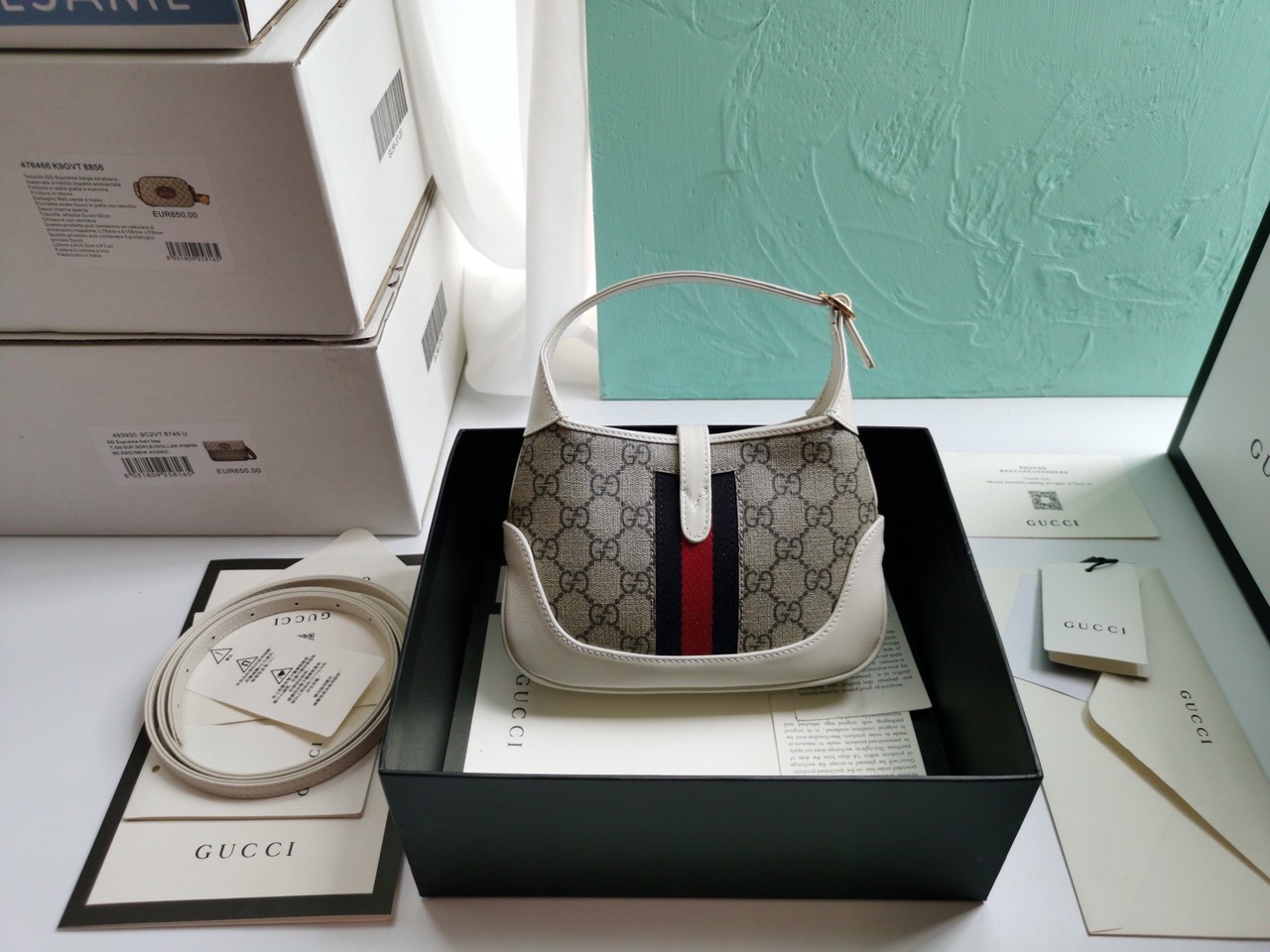 GUCCI Jackie 1961 Mini Hobo Bag. Original Quality Bag including gift box, care book, dust bag, authenticity card. The reintroduction of the Jackie bag in a mini size presents a new take on a historical Gucci icon. Brought back to the forefront, the recognizable shape is presented in leather and enhanced with an additional, detachable shoulder strap. Attached to the bag with a buckle closure, the second strap adds a contemporary feel to the archival style, providing new ways to wear—from top handle, shoulder to cross body. Pieces with versatile ways to wear and style embrace each person who is part of the House’s individual spirit. | CRIS&COCO Authentic Quality Designer Bags and Luxury Accessories