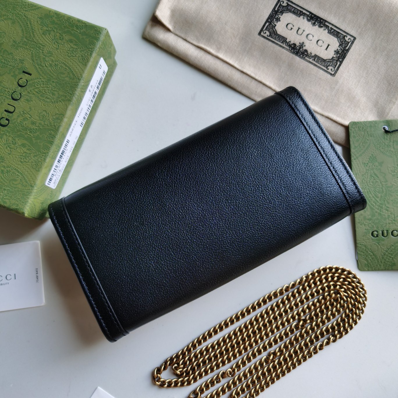 GUCCI Diana Chain Wallet With Bamboo. Original Quality Wallet including gift box, care book, dust bag, authenticity card. Paying homage to a material at the heart of Gucci’s heritage, this wallet is defined by its bamboo closure. Crafted from smooth leather, the accessory is completed by Guccio Gucci's monogram hardware and a delicate chain strap.| CRIS&COCO Authentic Quality Designer Bags and Luxury Accessories