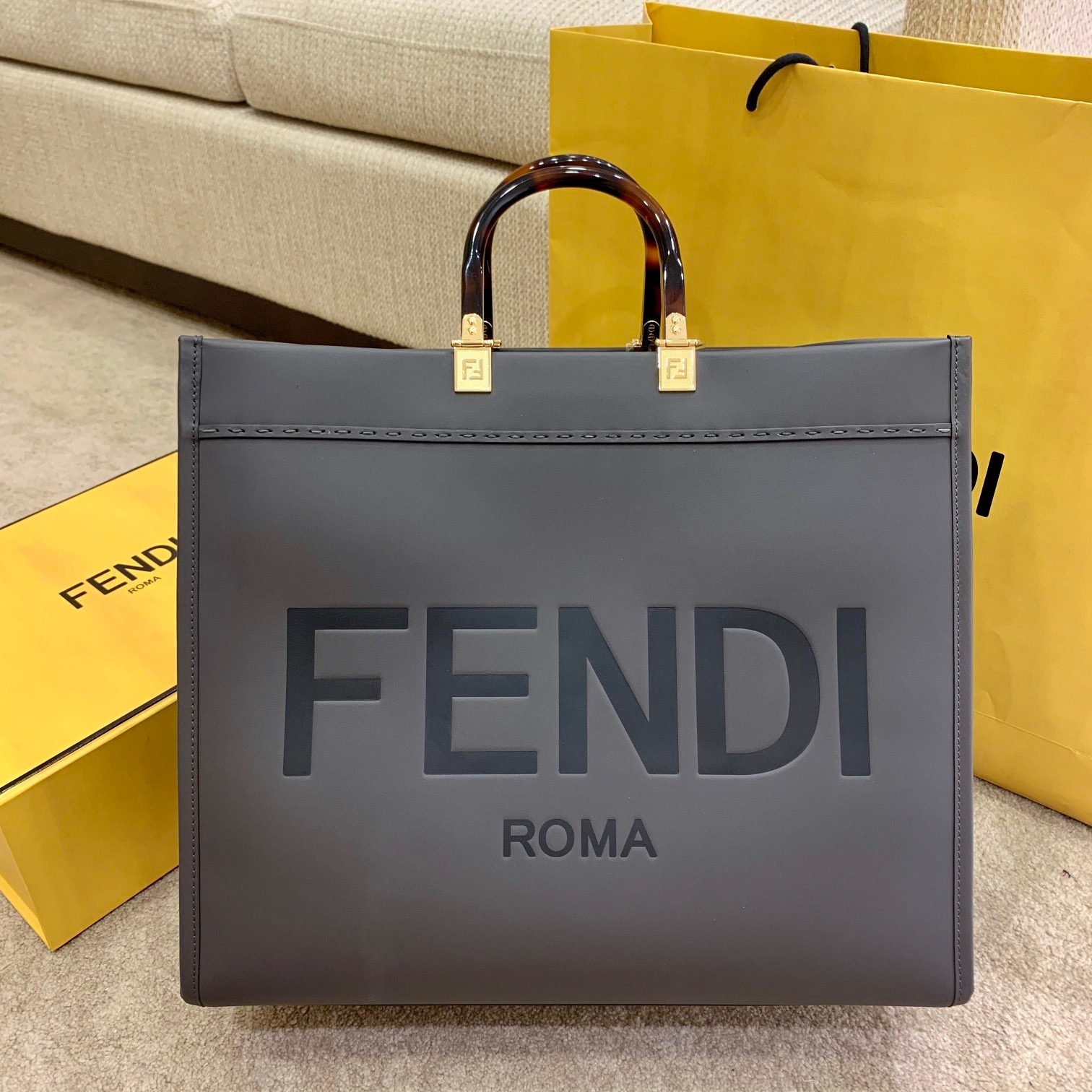 FENDI Sunshine Medium Tote. Original Quality Bag including gift box, care book, dust bag, authenticity card. Equipped with a spacious lined internal compartment, edges in tone on tone leather, and gold-finish hardware. Can be carried by hand or worn on the shoulder thanks to the two handles and detachable shoulder strap.| CRIS&COCO Authentic Quality Designer Bags and Luxury Accessories