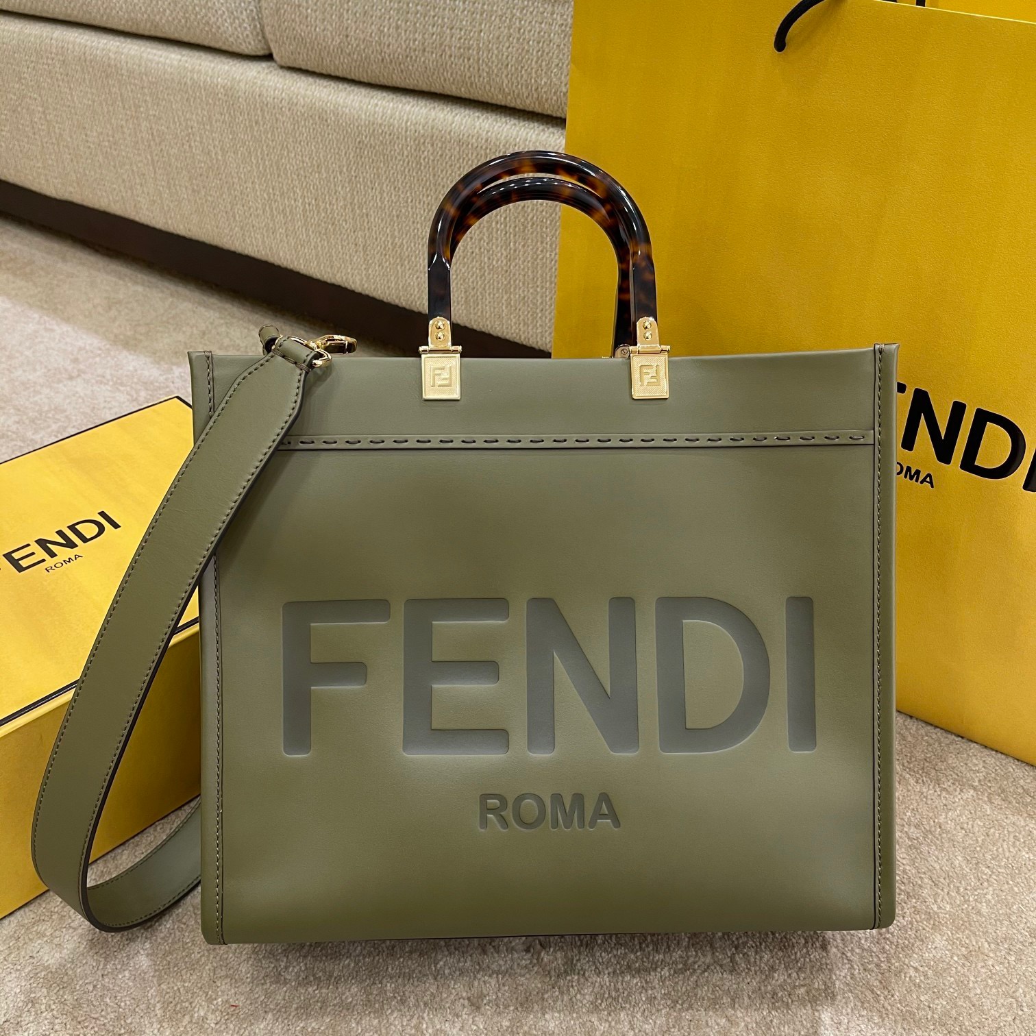 FENDI Sunshine Medium Tote. Original Quality Bag including gift box, care book, dust bag, authenticity card. Equipped with a spacious lined internal compartment, edges in tone on tone leather, and gold-finish hardware. Can be carried by hand or worn on the shoulder thanks to the two handles and detachable shoulder strap.| CRIS&COCO Authentic Quality Designer Bags and Luxury Accessories