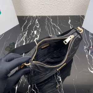 PRADA Padded Shoulder Bag. Authentic quality luxury bag crafted in genuine leather comes with authenticity card, dust bag and gift bag. Patchwork elegance meets functional versatility in this chic leather shoulder bag. This padded leather shoulder bag has a unique triangle-shaped patchwork stitching design, giving it a distinctive look. It features an adjustable logo-print woven nylon shoulder strap for added comfort. The front of the bag is adorned with the iconic enameled metal triangle logo, adding a touch of elegance. Additionally, this versatile accessory comes with a detachable zipper pouch that can be conveniently attached to the shoulder strap.