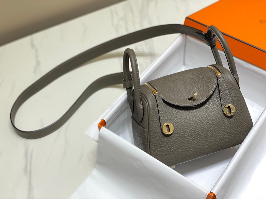 HERMÈS Mini Lindy. High-end quality bag including gift box, literature, dust bag, authenticity card. Maison HERMÈS is elevating the Lindy, with the introduction of the new Mini and is joining the holy Trinity, the Birkin, Kelly, and Constance.| CRIS AND COCO Authentic Quality Luxury Accessories