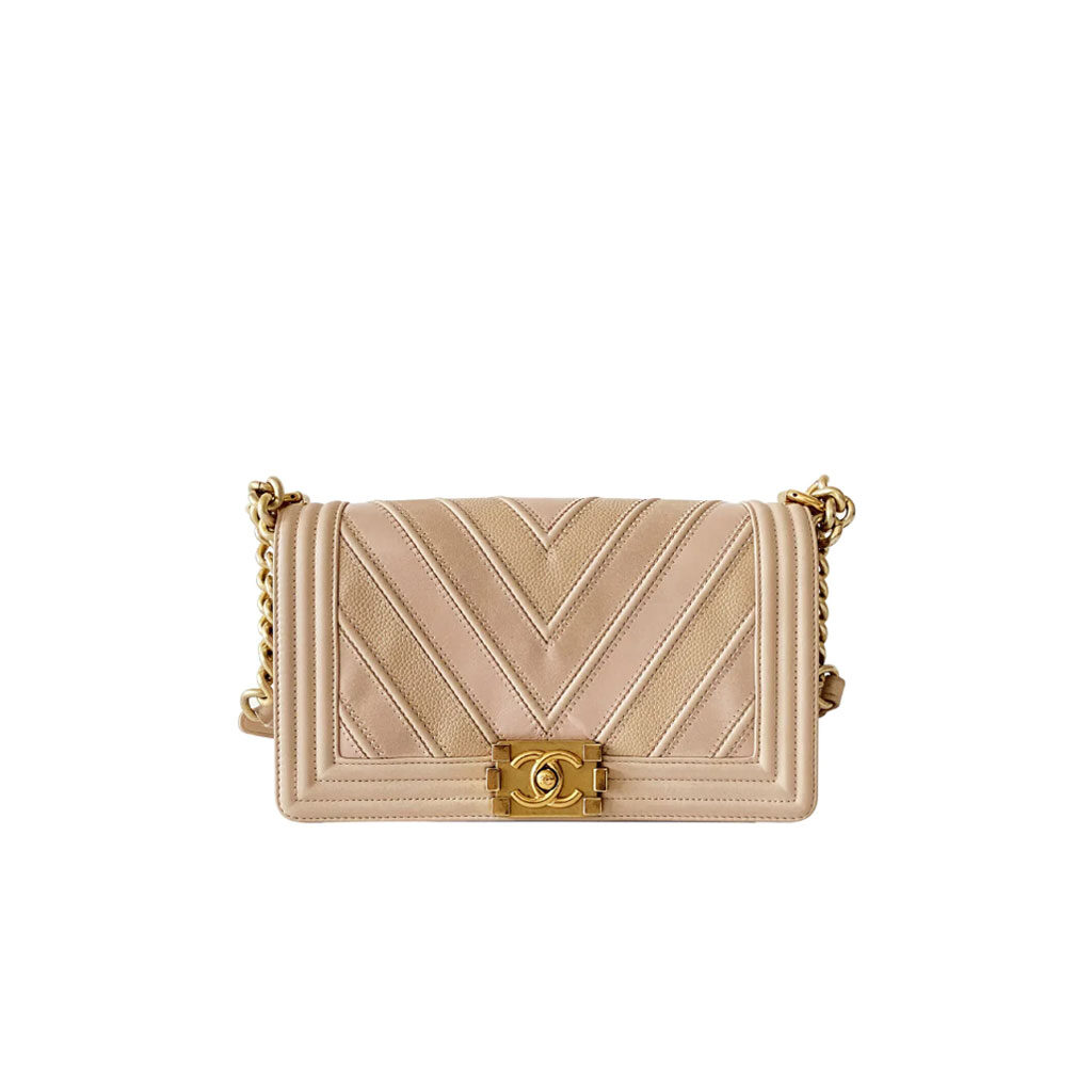 CHANEL Medium Chevron Mix Leather Boy Bag. Original Quality Bag including gift box, care book, dust bag, authenticity card. Chanel introduces a new style for their iconic Boy Bag. For the brand’s Spring/Summer 2016 Collection, this Boy Bag comes in a mix of three different leathers: Calfskin, Suede Calfskin and Grained Calfskin. A handle-chain in gilded metal allowing a carried hand or shoulder. This is a marvelous shoulder bag for day or evening and just the essentials, from Chanel! | CRIS&COCO Authentic Quality Designer Bag and Luxury Accessories