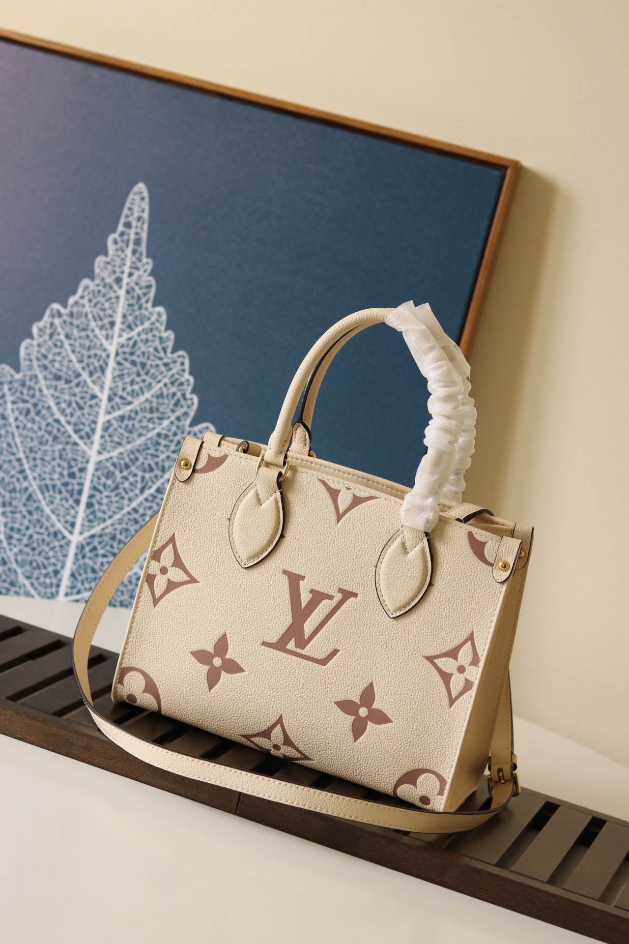 LOUIS VUITTON Onthego PM. Original Quality Bag including gift box, care book, dust bag, authenticity card. Inspired by Louis Vuitton’s famous Sac Plat from 1968, the Onthego PM tote is fashioned in Monogram Empreinte leather, embossed with a Giant Bicolor Monogram pattern. This smaller version of the original Onthego fits essentials such as an iPad Mini. Articulated top handles and an adjustable removable strap offer a variety of carry options. | CRIS&COCO Authentic Quality Designer Bags and Luxury Accessories