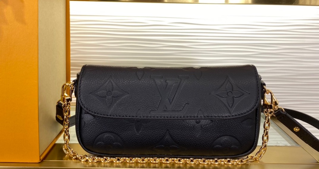 LOUIS VUITTON Wallet on Chain Ivy. Original Quality Bag including gift box, care book, dust bag, authenticity card.  The on-trend Wallet on Chain Ivy is made from grained Monogram Empreinte leather, embossed with an oversized Monogram motif. The perfect day-to-evening companion, it can be carried as a clutch, worn close to the shoulder with its short gold-color chain, or for a more casual attitude, carried cross-body thanks to its removable and adjustable leather strap. | CRIS AND COCO Authentic Quality Luxury Accessories