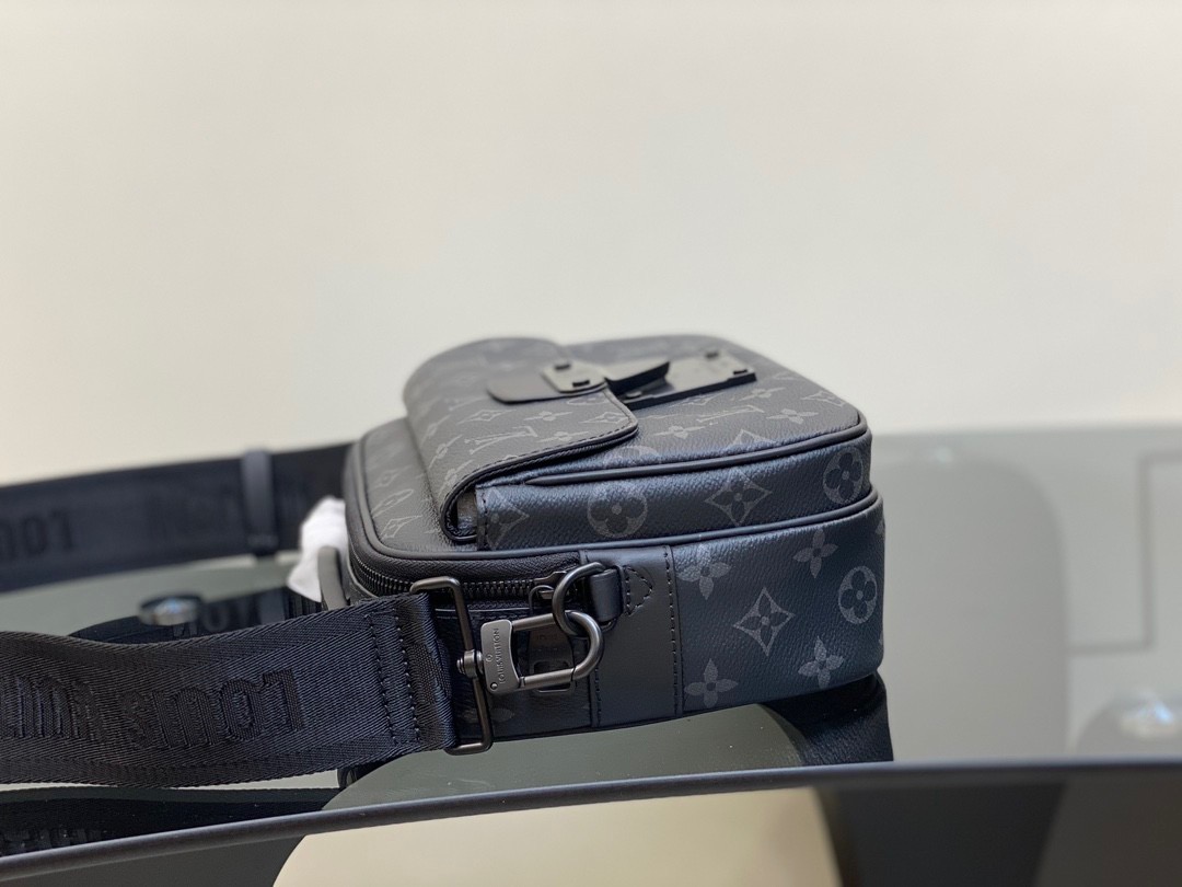 LOUIS VUITTON S Lock Messenger: A Fusion of Timeless Elegance and Modern Style. The S Lock Messenger in Monogram Macassar canvas showcases a unique closure, drawing inspiration from a trunk lock crafted by Georges Vuitton back in 1886. A meticulous finishing technique imparts the magnetic metal clasp with a strikingly contemporary appearance. Moreover, this avant-garde bag boasts a spacious zipped compartment, reminiscent of classic trunks, along with a luxurious leather handle and an iconic LV signature strap. Together, these features render it a fashionable and convenient accessory. | CRIS&COCO Authentic Quality Designer Bags and Luxury Accessories