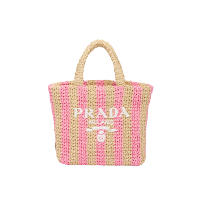 Small Crochet Tote Bag. Elevate Your Look with an Exquisite Tote Bag! This exquisite tote bag has a deconstructed design made of a light, natural material with a summery mood, raffia-effect yarn. Embroidered lettering logo decorates the front, and the emblematic triangle in enameled metal is the perfect finishing touch to the side. | CRIS&COCO Authentic Quality Designer Bags and Luxury Accessories