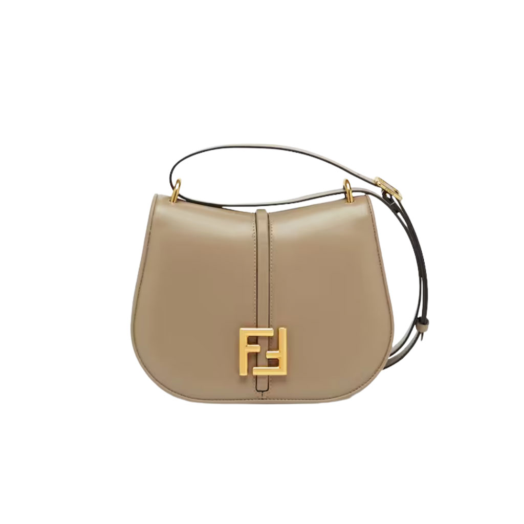 C’mon Medium. Timeless Elegance, Embodied in Leather. Elegantly designed, this medium-sized satchel bag boasts graceful, curved lines that exude femininity. Its elongated flap is adorned with a striking metal FF logo, adding a touch of sophistication to its overall charm. Crafted from supple leather with meticulously embossed edges and intricate details, this bag radiates a sense of refined luxury. The sides of the bag seamlessly blend with the overall design, crafted from the same tone-on-tone full-grain leather, ensuring a harmonious and visually pleasing aesthetic.