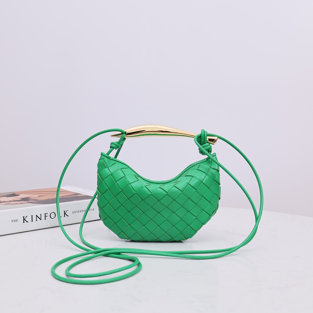 BOTTEGA VENETA Mini Sardine. Crafted to Perfection, Inspired by Nature: Your Timeless Companion for All Occasions. Bottega Veneta's masterful intrecciato weaving technique was originally crafted to ensure the enduring quality of leather goods. The Sardine Mini leather shoulder bag, meticulously fashioned from supple lamb leather, showcases a distinctive top handle reminiscent of a graceful fish. This versatile piece seamlessly transitions from day to night, making it the perfect, reliable companion to elegantly accommodate all your essentials.