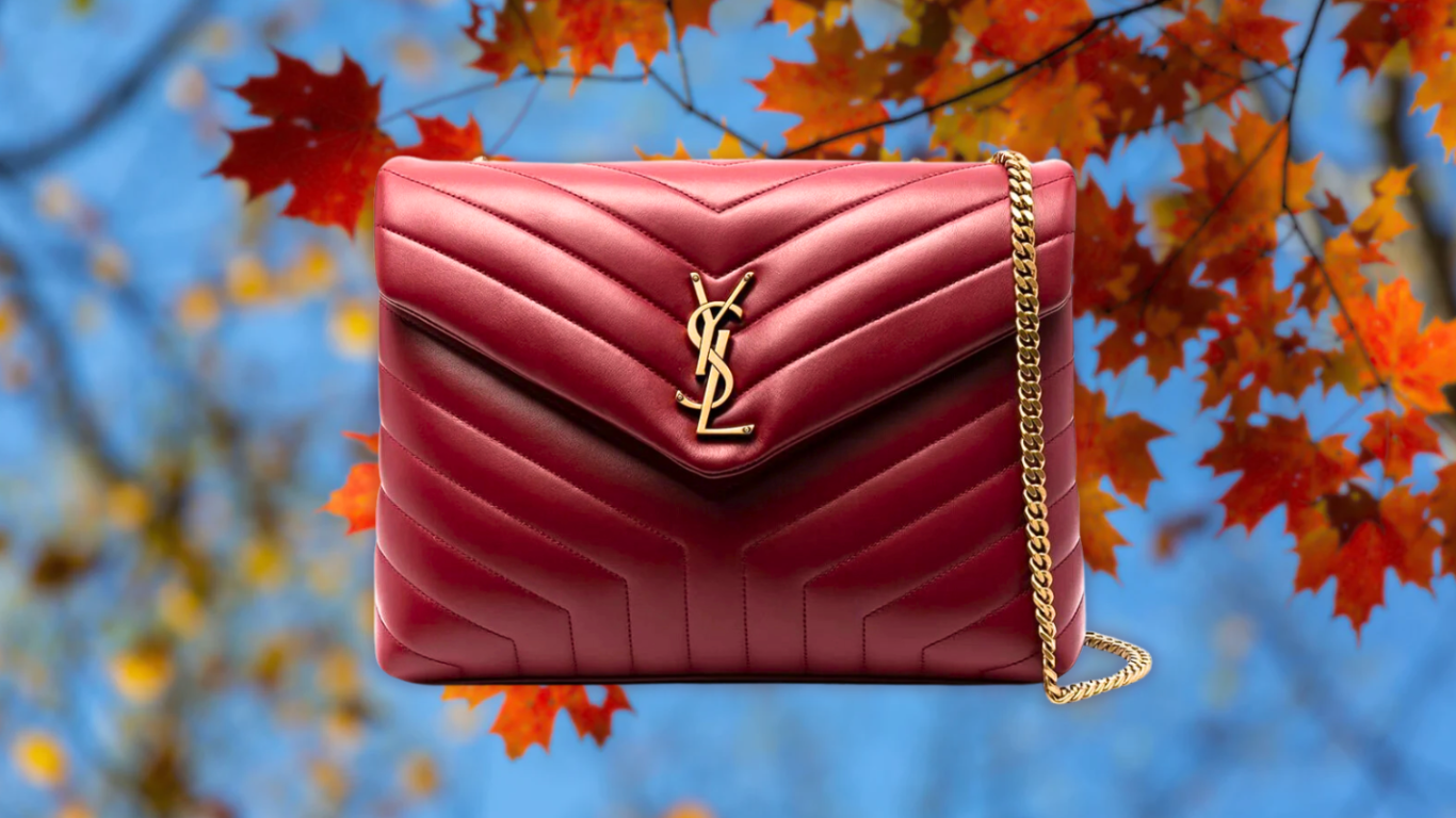 SAINT LAURENT Loulou bag with autumn leaves SAINT LAURENT Loulou bag in brown leather surrounded by autumn leaves
