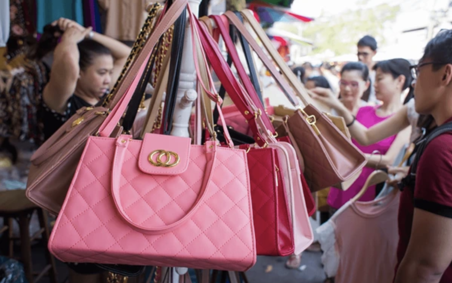 Fake designer bags in an urban setting.