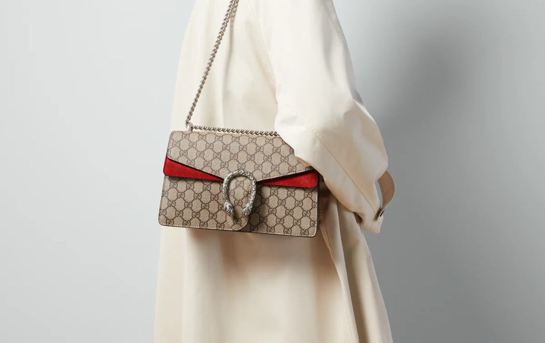 Daringly Elegant: A Closer Look at the GUCCI Dionysus Bag  Close-up of the GUCCI Dionysus bag with tiger head clasp.