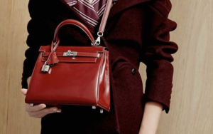 Iconic Red Hermès Kelly Bag - CRIS&COCO Red Hermès Kelly bag with classic structured silhouette and gold hardware