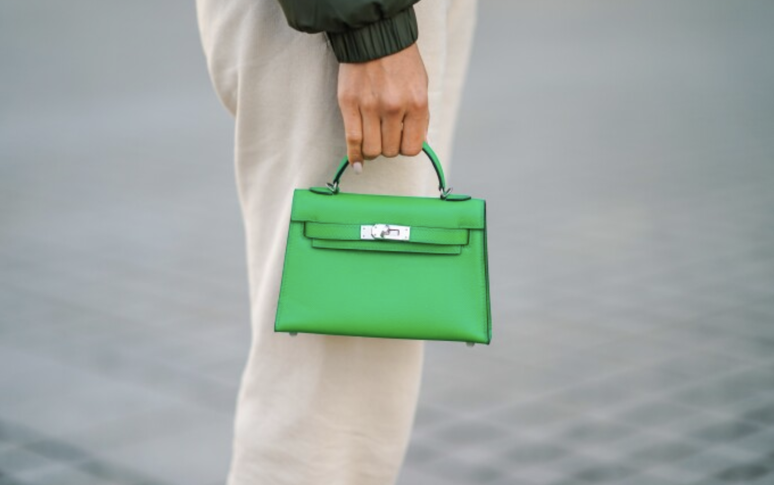 Elegant Green Hermès Kelly Bag Green Hermès Kelly bag with classic structured shape and silver hardware