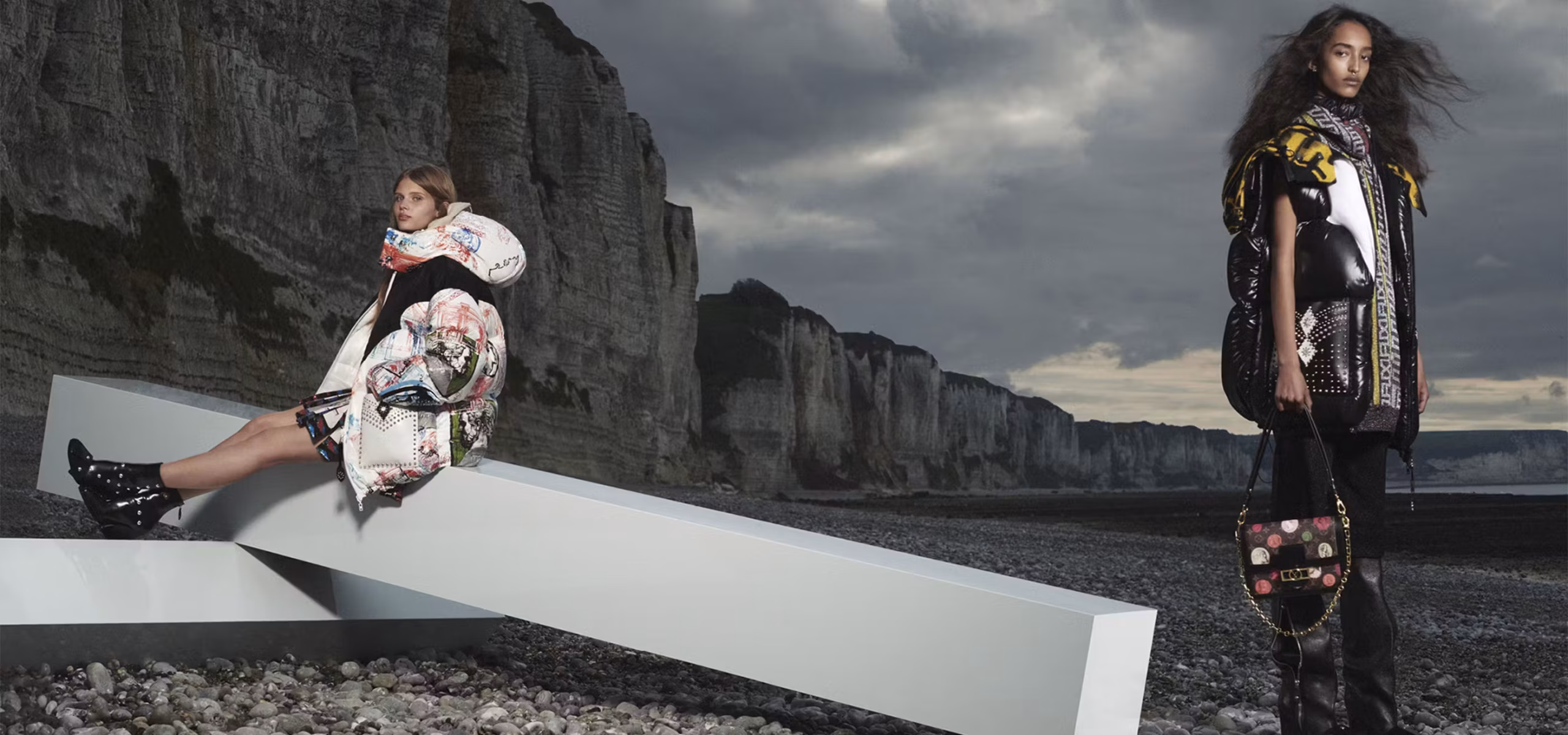 LV models showcasing their luxury bags. LV models showcasing their luxury bags.