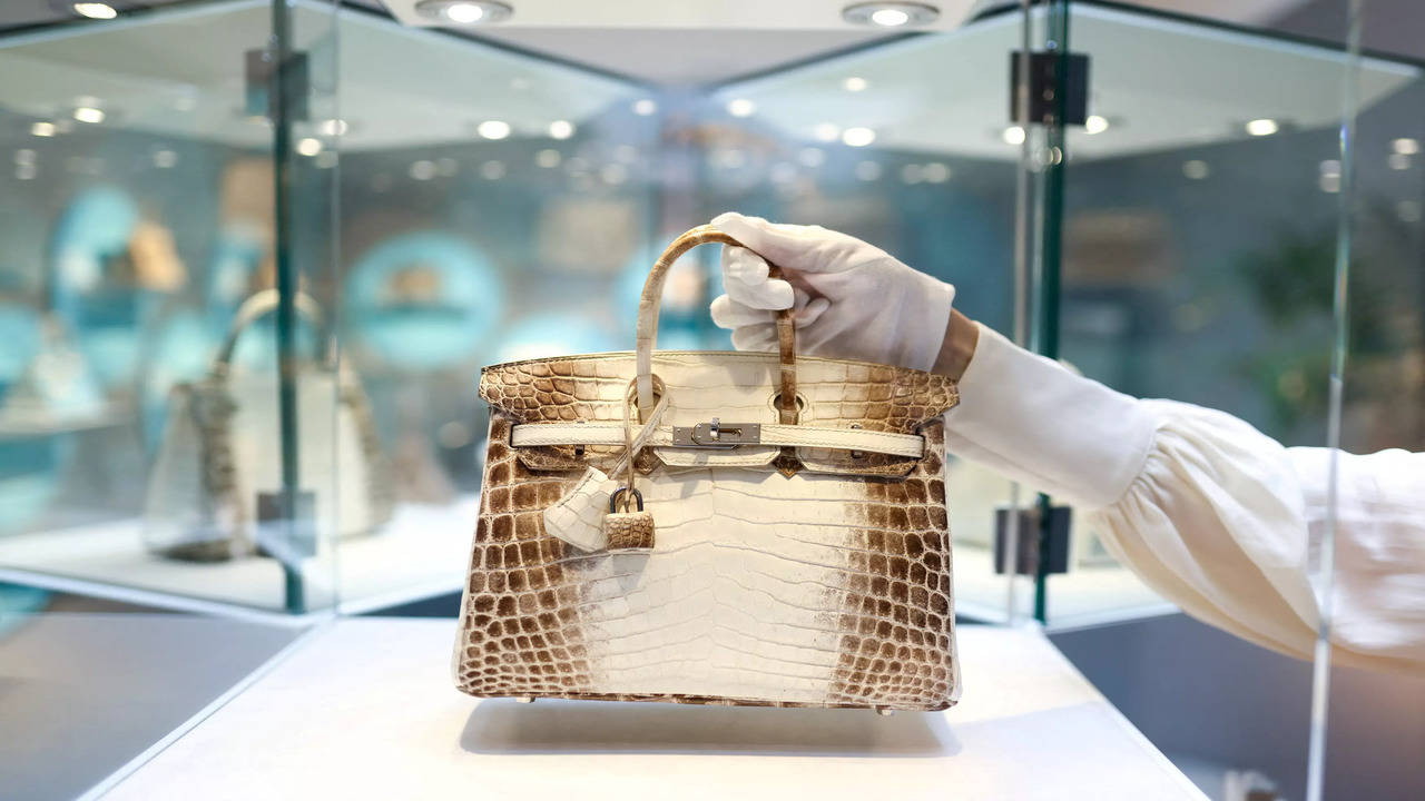 A luxury handbag marketplace with counterfeit and authentic bags displayed side by side.