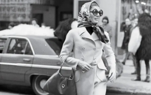 ackie Kennedy Onassis elegantly carrying her signature GUCCI bag.