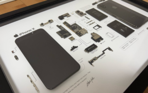 A disassembled iPHONE showing its internal components.