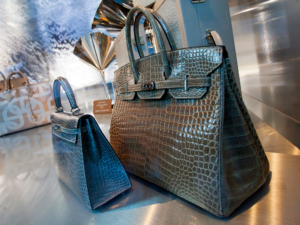 A high-end boutique display showcasing a luxury handbag, positioned like a sacred artifact.
