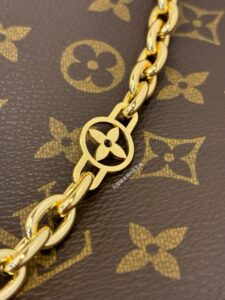 CarryAll BB. Authentic quality luxury bag crafted in genuine leather comes with authenticity card, dust bag and gift bag. Effortless Elegance, Day to Night – The CarryAll BB Reimagined. The iconic CarryAll BB returns this season with a stylish twist, perfect for transitioning from day to evening. Expertly crafted from the House’s signature Monogram canvas, it’s elevated with a gleaming gold-toned chain adorned with Monogram Flowers. Thoughtful details like the contrasting leather name tag and matching lace closure add a refined touch. Inside, a zipped pocket offers a convenient spot to keep your everyday essentials—like a credit card—close at hand.