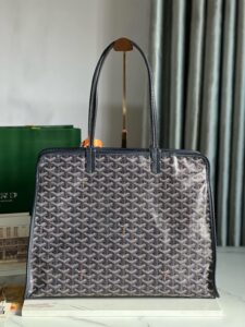 Hardy PM Bag. Authentic quality luxury bag crafted in genuine leather comes with authenticity card, dust bag and gift bag. Effortless Elegance, Everyday Function. The Hardy PM bag is the perfect companion for everyday use or work, easily fitting A4 files with ease. Designed for those who value lightness, flexibility, and added security, it features a zip closure to keep your essentials safe. With long, comfortable handles, it's ideal for carrying over the shoulder all day with ease.