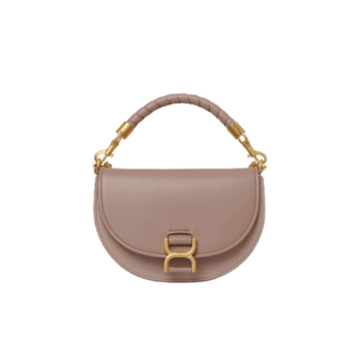 Marcie Chain Flap Bag. Authentic quality luxury bag crafted in genuine leather comes with authenticity card, dust bag and gift bag. Elevating Iconic Elegance: Marcie Line Redefined. Experience a fresh take on *loé's iconic Marcie line with this exquisite chain flap bag, meticulously crafted from a captivating blend of nappa lambskin, grained calfskin, and sumptuous suede. The line's signature hardware undergoes a graceful transformation, now adorned with *loé's engraved jewelry hallmark, adorning the flap with sophistication. An intricately hand-braided top handle pays homage to another hallmark Marcie feature, while a gracefully extended chain strap adds a refined touch. Whether you choose to drape it over your shoulder or wear it cross-body during the day, or opt to detach the strap and carry it by hand for a sophisticated evening ensemble, this flap bag is a versatile masterpiece. *loé's Marcie bag line effortlessly melds a feminine aesthetic with the free-spirited vibe of the '70s. An equestrian-inspired allure takes center stage, elevated by the allure of gleaming gold-toned hardware, resulting in a distinctly feminine yet timelessly chic look.