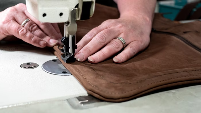 A handmade leather bag in a New York workshop A handmade leather bag in a New York workshop