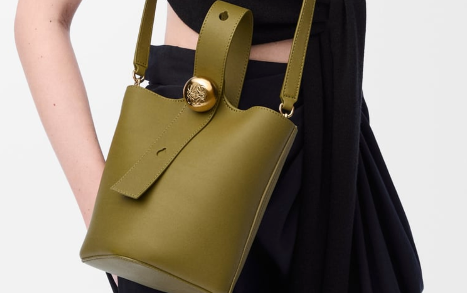 A clean, minimalist product shot of the Mini Pebble Bucket Bag by Cris & Coco A clean, minimalist product shot of the Mini Pebble Bucket Bag by Cris & Coco