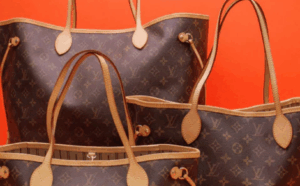 The canvas says status. The leather just tries to keep up.